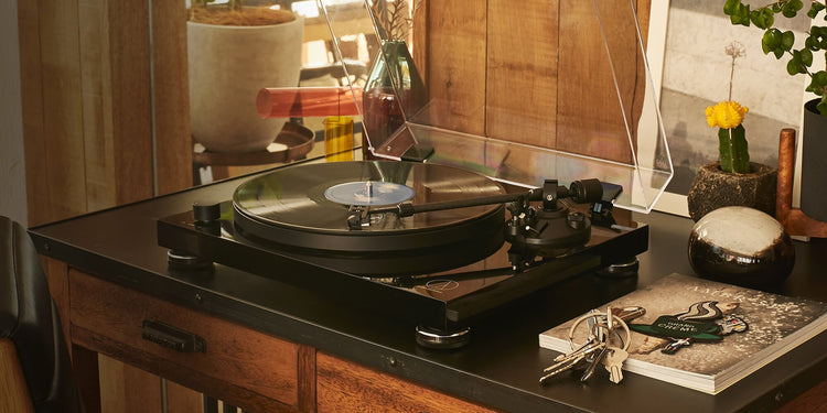 Vinyl turntable and record player for home listening playing a record on a hi-fi system