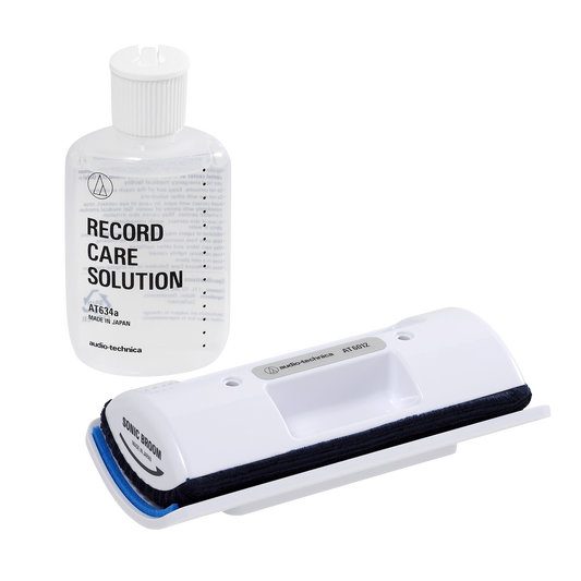 Audio-Technica AT6012 cleaning brush and record care solution bottle on a white background