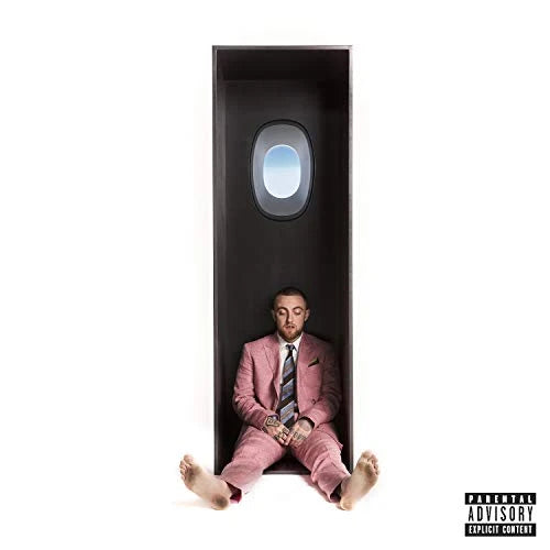 Mac Miller -Swimming vinyl LP album cover featuirng a minimal portrait of Mac Miller seated in a suit.